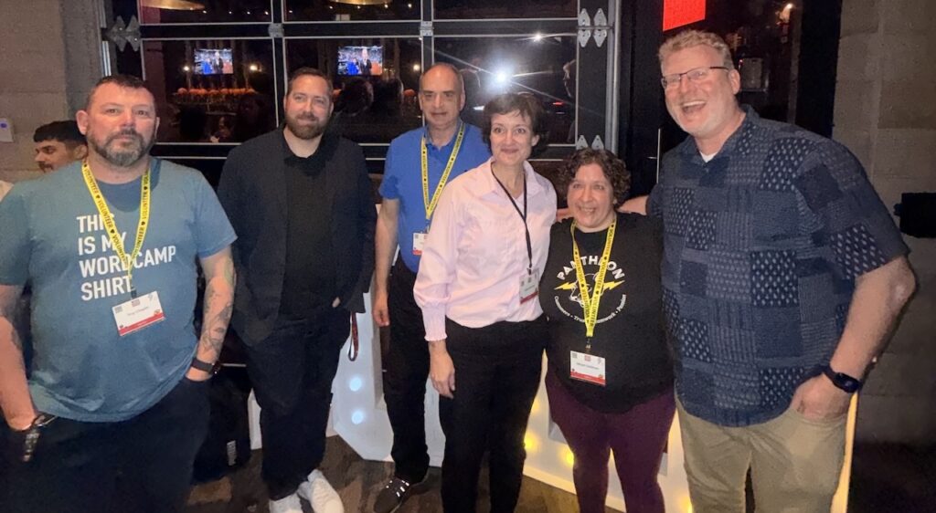 A group shot of the 2025 WordCamp Canada organizing team during the after party at Craft Beer Market.